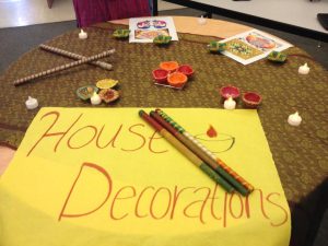 The table shows the different decorations, including diyas (candles), that are used during Diwali, the Hindu festival of lights.  Photo: Chandni Patel