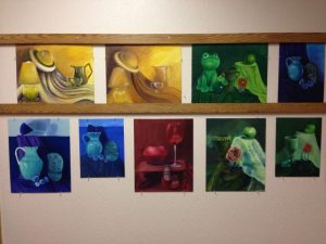 A collection of paintings done by Ms. Parker's AP studio art students.