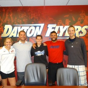 After making the team, Laura Hubacek (center) was able to have an official greeting with the coaching staff at the University of Dayton.  Photo Credit: Laura Hubacek 