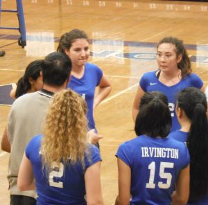 Lady Vikings head coach Michael Young talking to his players during a timeout. PC: Channing Whitaker