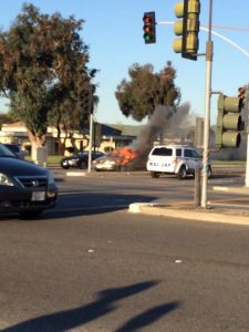 Flames rise high on the stopped car before fire department arrives. (PC: Katherine Chen)