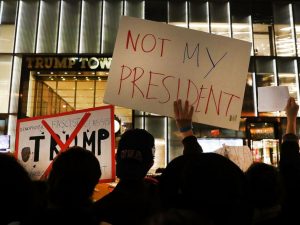 A group of protesters line up outside Trump Tower in New York a day after the election. Across the country, concerned and upset citizens came out in droves to voice their discontent with the election results.