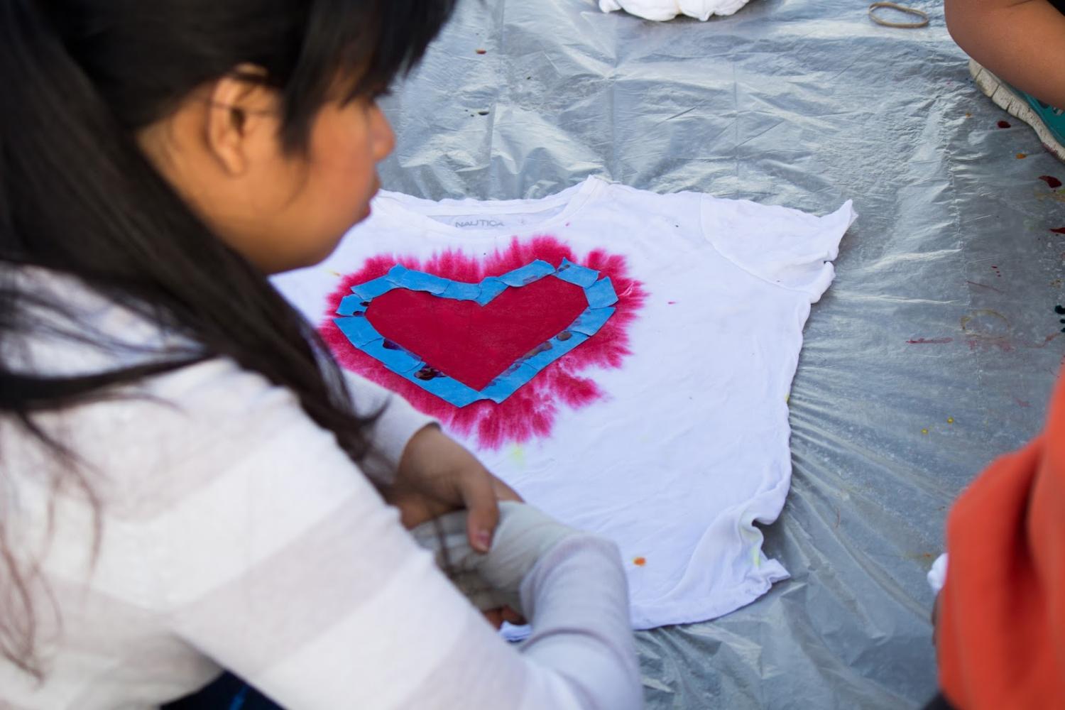 Students used rainbow colors to dye their shirts and custom designed their white crews by using tape to create hearts or patterns to display their pride.