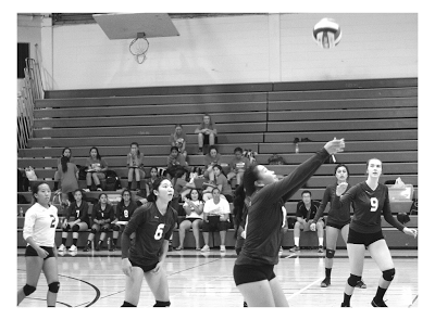 Girls’ Varsity Volleyball prepares to score against American.