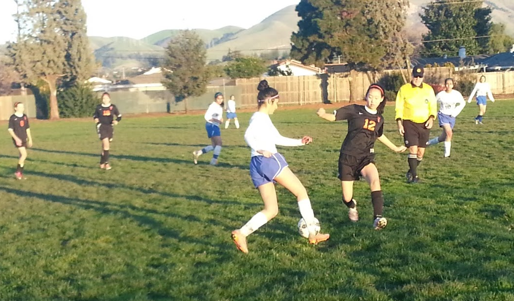 Junior Sarah Assao dodges Washington defenders in a rush towards the opposing goal in the second half. 