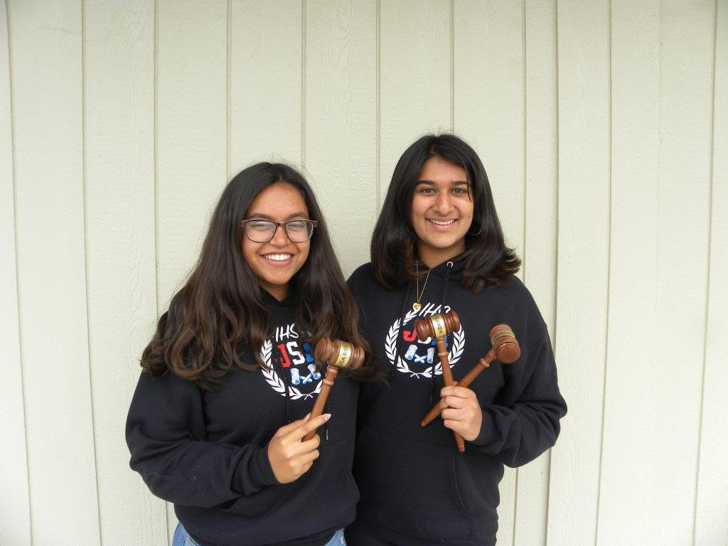Karina Gulati and Nidhi Chirayath, pictured above, hold trophies, depicting their victory in the JSA Spring States competition.