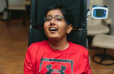 Ronil Mehta (9) smiling at age 13 for a photoshoot.
Donate to Ronil through: https://www.gofundme.com/hope-for-ronil
(Photo: Robin Ivy).

