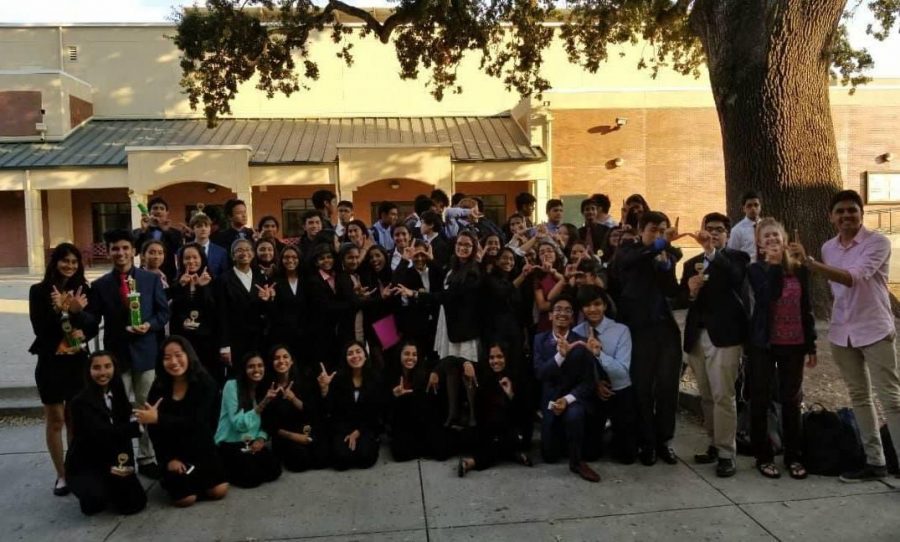 The+Irvington+Debate+team+rejoices+after+the+awards+ceremony.