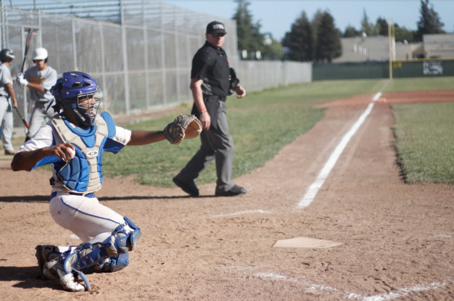 Irvington's catcher, Kanshat Patel (12) throws his pitcher another baseball. 