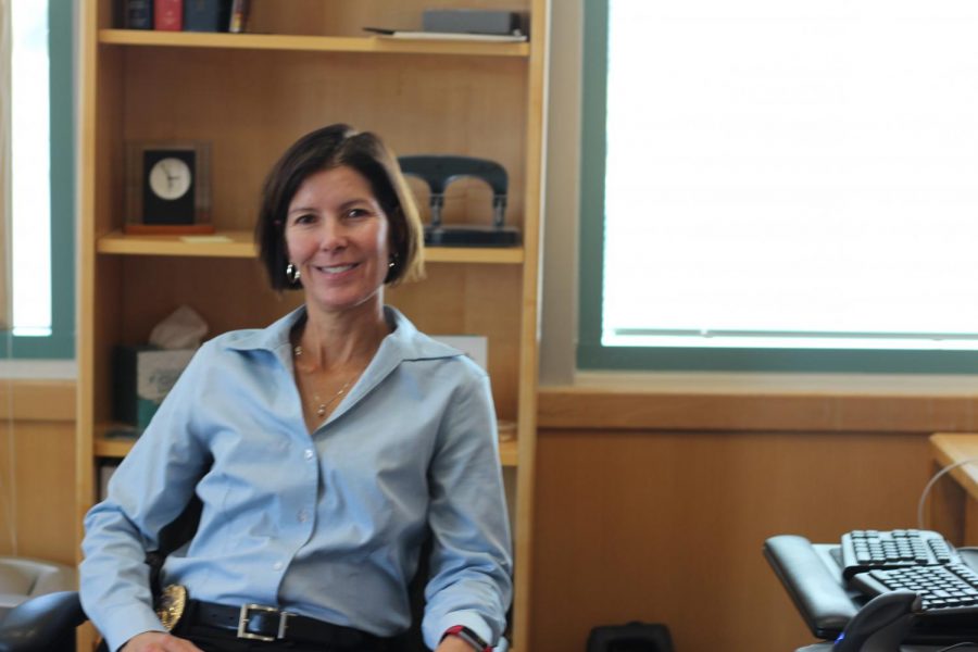 Kim Petersen, Stanford graduate, twenty-two year veteran to the police force, and first female Fremont police chief, poses for a picture at her office desk.