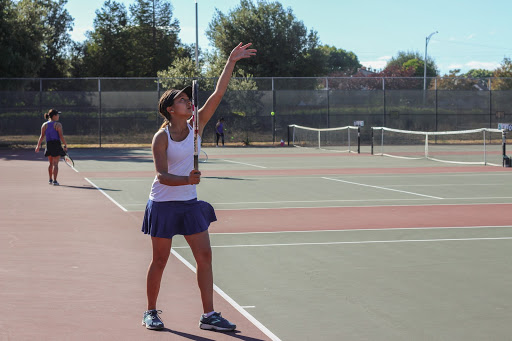 Priyanka Gupta-Martinez (10) steps up to serve a ball during the first set.