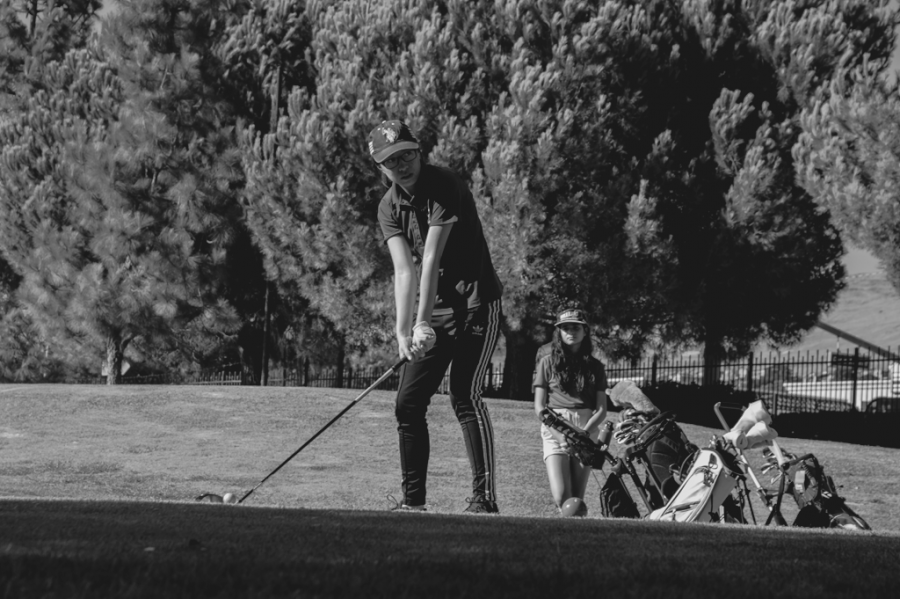 Cindy Lee looks ahead as she tees off