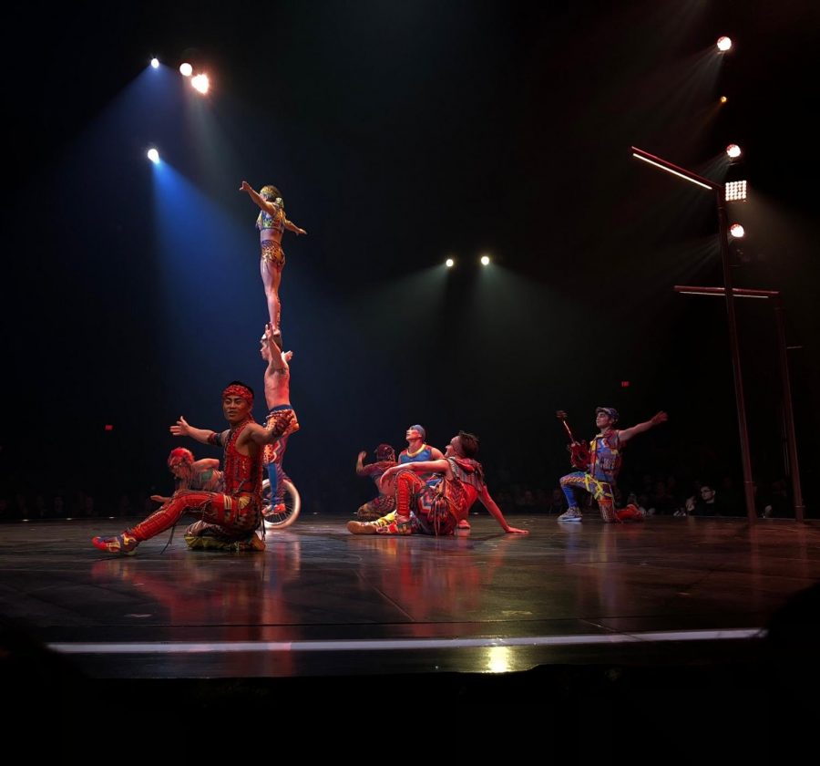 This segment of the performance included a man on a tricycle as a woman standing on his shoulders did flips.