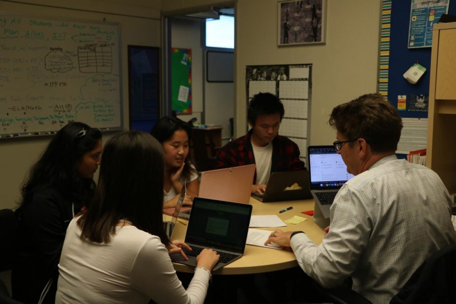 The current members of the student task force looks over student applications to join the group as they expand their membership. 