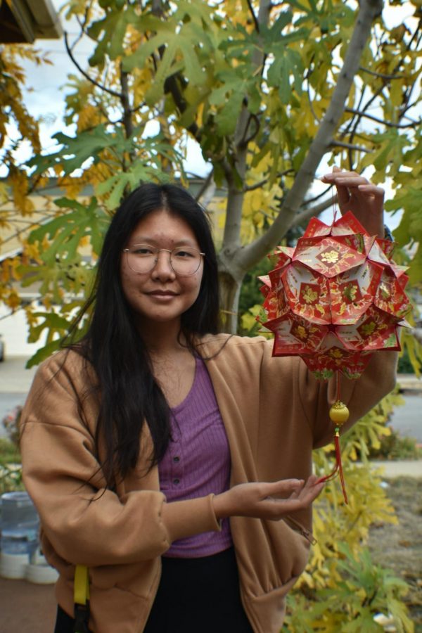 During Tết, Crystal Nguyen (11) and her family decorate their home with lanterns made out of red envelopes.