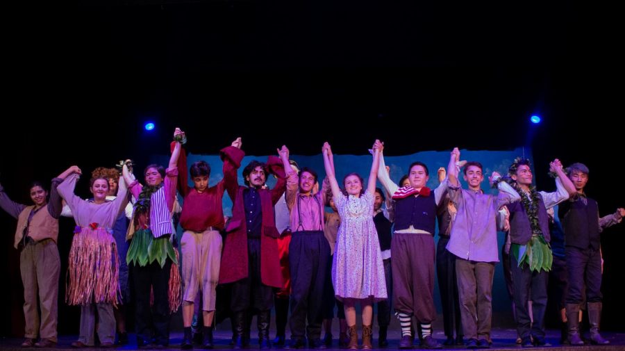 The cast bows at the end of the play