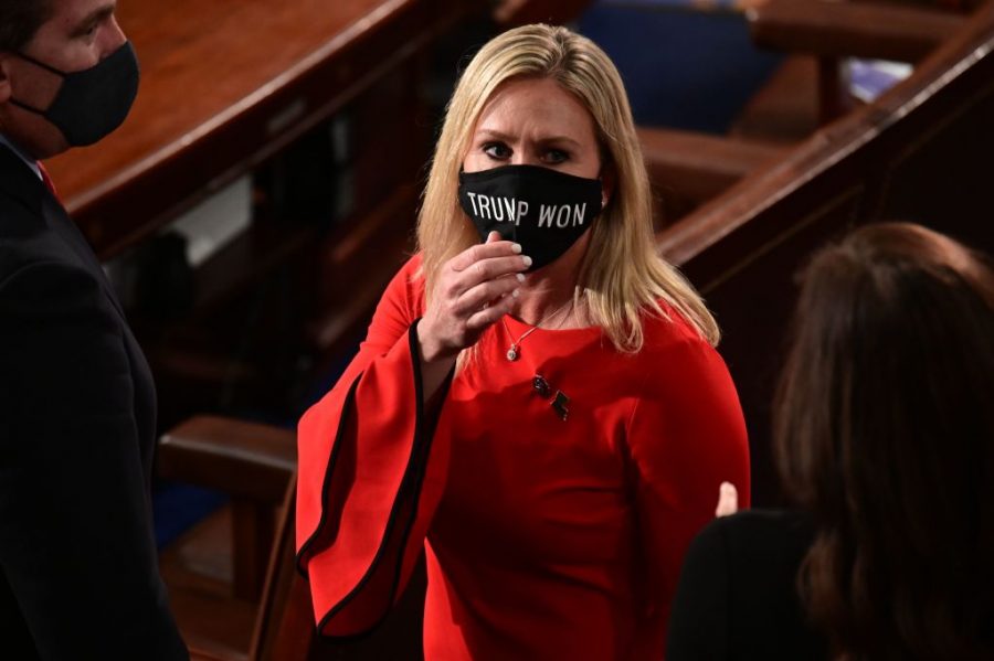 Representative Marjorie Taylor Greene wears a mask reading “Trump Won,” three days before the deadly insurrection at the Capitol.  