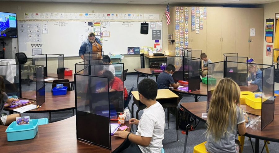 In person learning would likely feature precautions such as shields, masks, and distance to protect students and teachers.