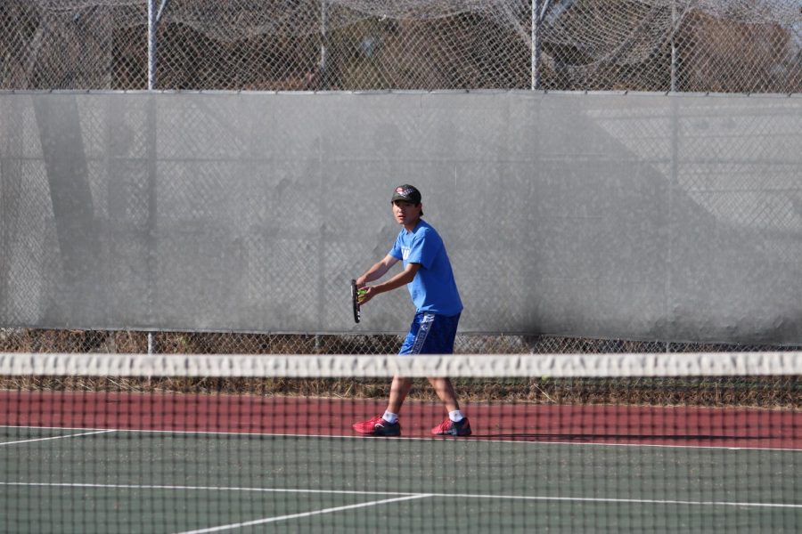 MVP Sunny Liu (11) prepares to serve. This photo was taken last season, pre-COVID.