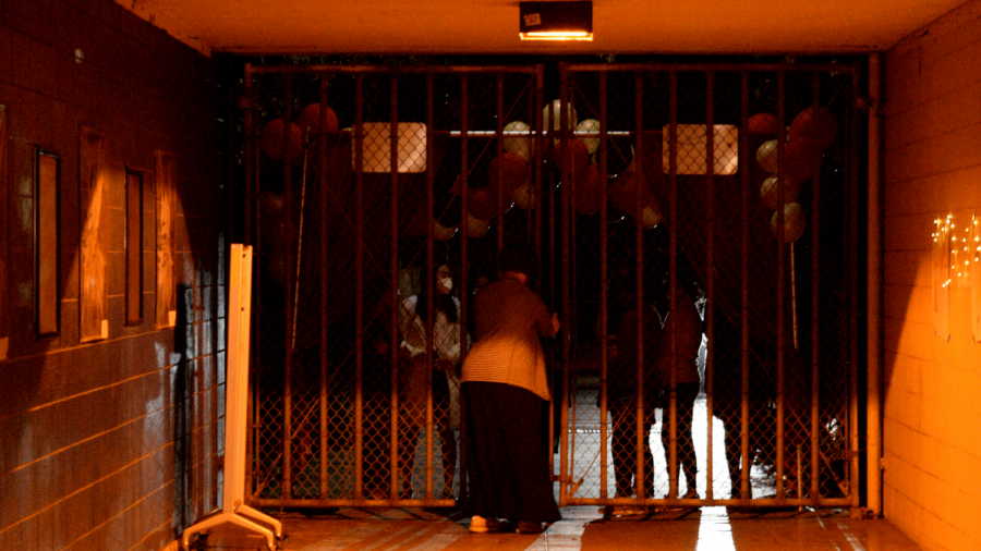 Irvington Principal Nathania Chaney-Aiello holds back late entrants at the Victory Tunnel entrance.