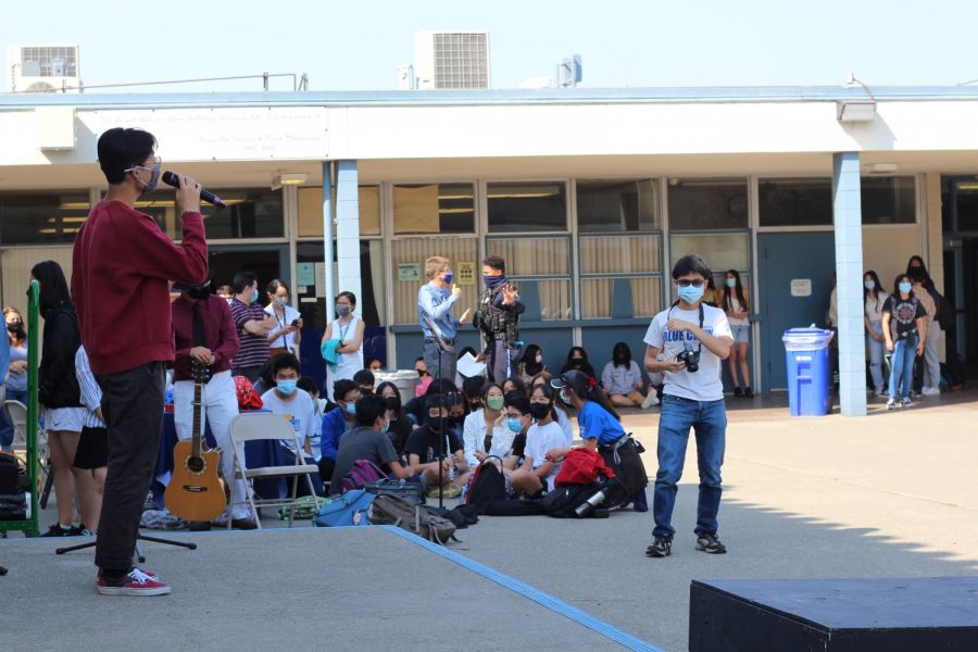 Dylan Lee (11) sings a cover of Lemon by Kenshi Yonezu at the during FLEX as other students listen. 