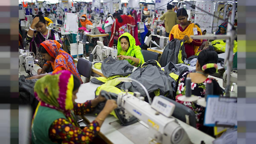 A fast fashion clothing production factory in Bangladesh is pictured where employees are paid unfair wages and forced to work continuously for hours without breaks.