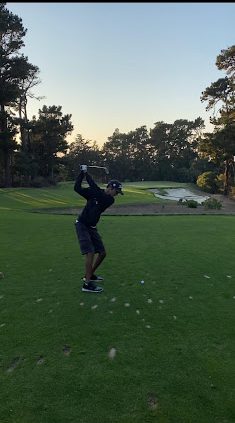 Reyhaan Rashid (10) tees up to strike the ball.