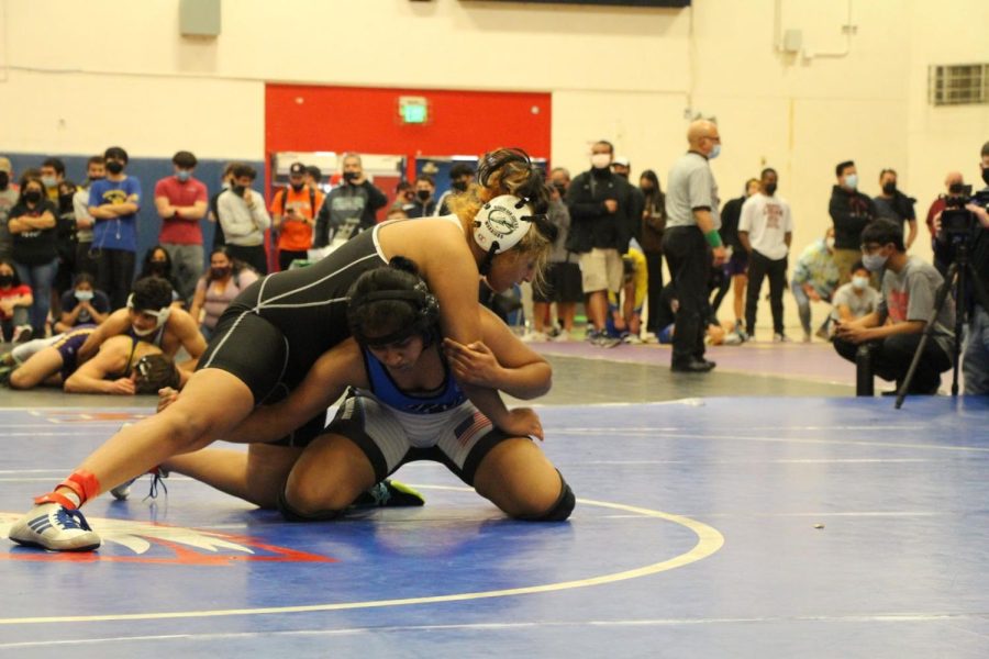 Third-year wrestler Harshana Jawahar (11) fights against her final opponent from Mission San Jose.