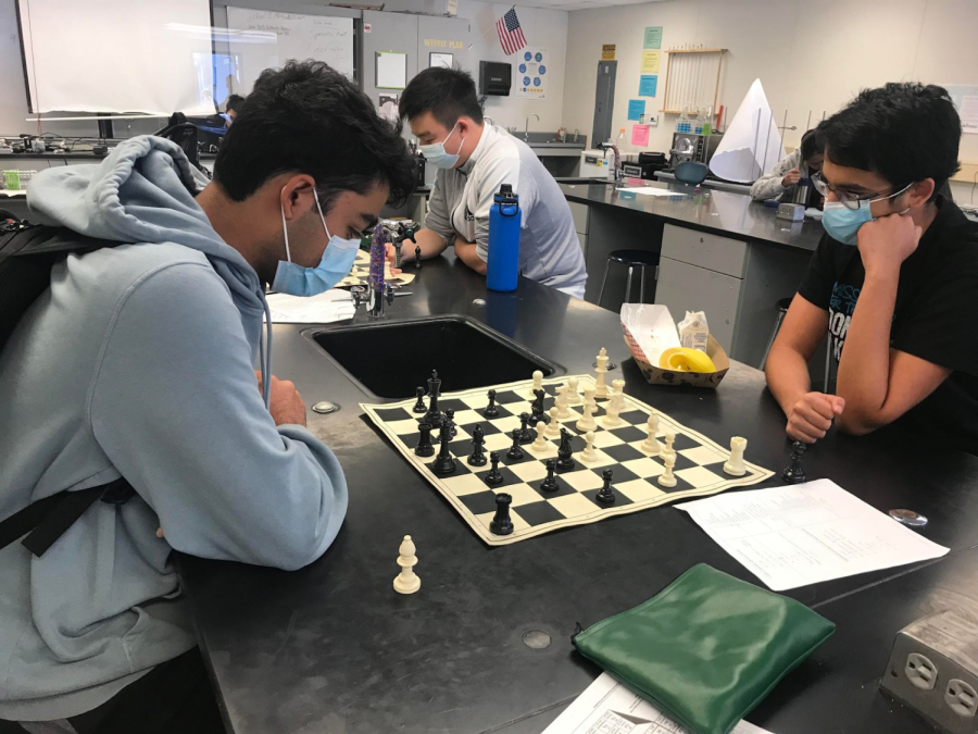 Two students concentrate on their game during one of Chess clubs weekly meetings.  