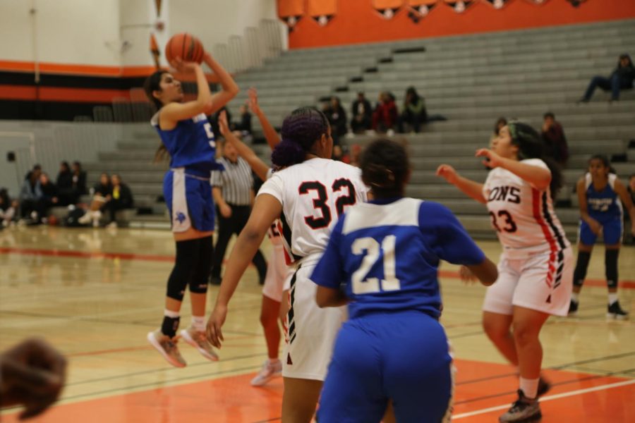 Nazaneen Hasanzada (11) sinks a powerful jump shot.  
