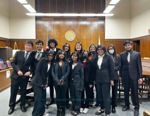 Irvington Mock Trial’s prosecution team and spectators pose after their Semi Finals round. 