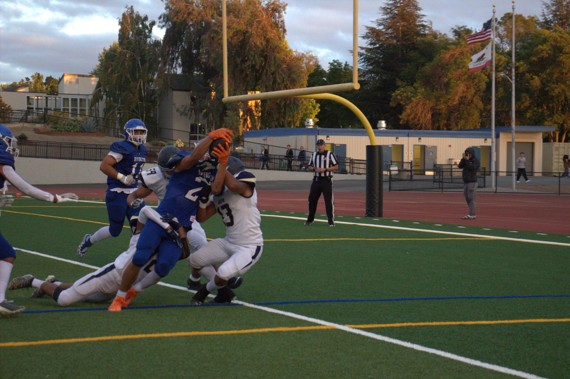 #23 Matty Forbes(11) fights his way into the end zone.
