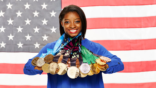 Simone Biles poses during the awards ceremony after winning the all-around of the Core Hydration Classic at NOW Arena in Hoffman Estates, Illinois, August 5 (Reuters).