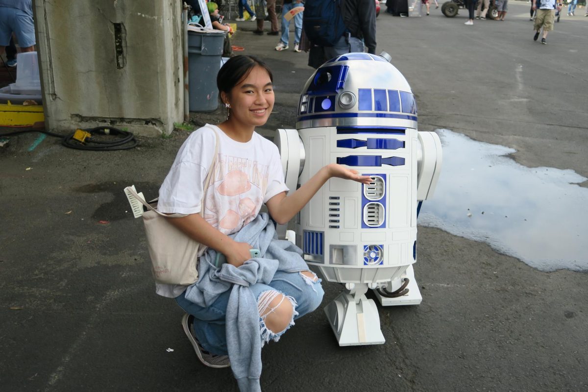 Sheryl Sun poses with R2D2, one of Maker Faire’s many awe-inspiring projects.
