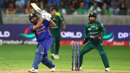 Star Indian batsman Rohit Sharma lofts a ball high into the air, and was pivotal in helping India win their rivalry match against Pakistan (Getty Images).
