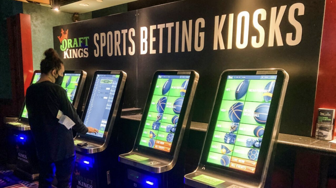 Caption: Sports gambling companies such as Draft Kings have become extremely profitable businesses.