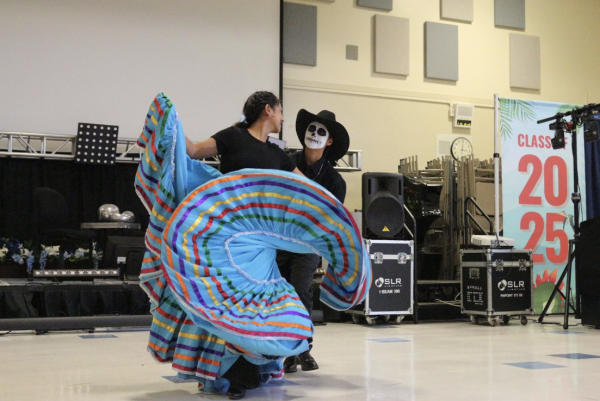 Lethzy Cortez (11) and Samantha Lizarraga (11), members of Folklorico Group A, perform the traditional dance of folklorico at Irvington MEChA’s Day of the Dead celebration.