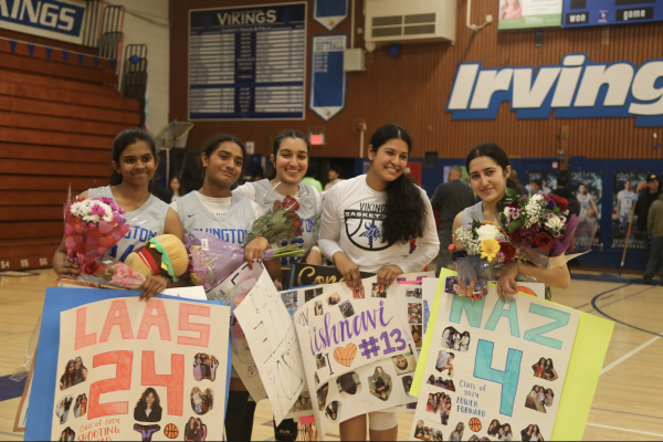 Left to Right: Laasya Mandela (12), Rizelle Ramesh (12),  co-captain Maryah Abdussamy (12), Vaishnavi Chippa (12), and team captain Naz Hasanzada (12) pose on senior night with the numerous gifts received from friends and family. 