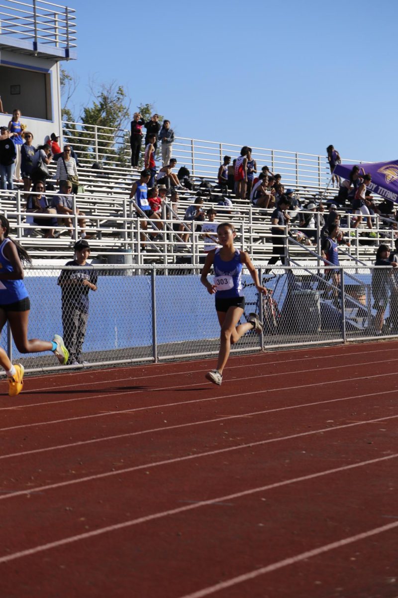 Audrey (9) earned athlete of the week from the coach and runs diligently to finish well in her race.