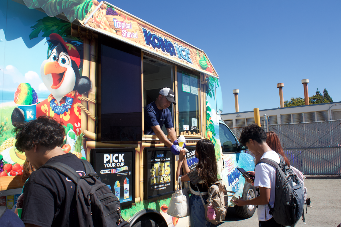 Students purchase shaved ice from Kona Ice, one of many activities offered at Vikenight.