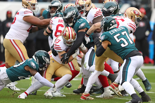 San Francisco 49ers runningback Christian Mccaffrey making his way through countless Eagles to score the 49ers first, and only touchdown in the NFC championship (Bill Streicher).
