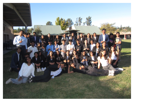 Irvington Debate poses for a group picture after a successful tournament, awards in hand.