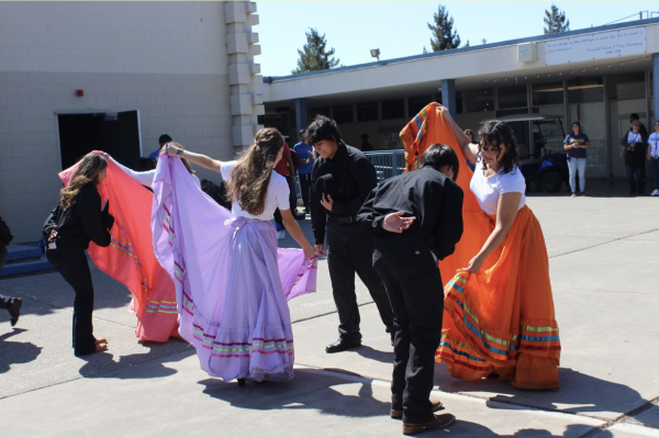 Caption: MEChA’s Sazon Latino dancers performing a traditional Folklorico dance to conclude Hispanic Heritage Week