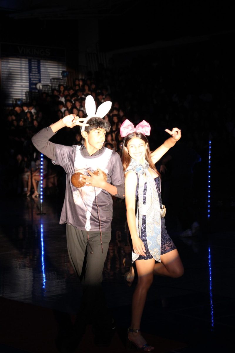 Sophomore class officers Jay Bhimani and Maya Rao show off their outfits after the class dance.