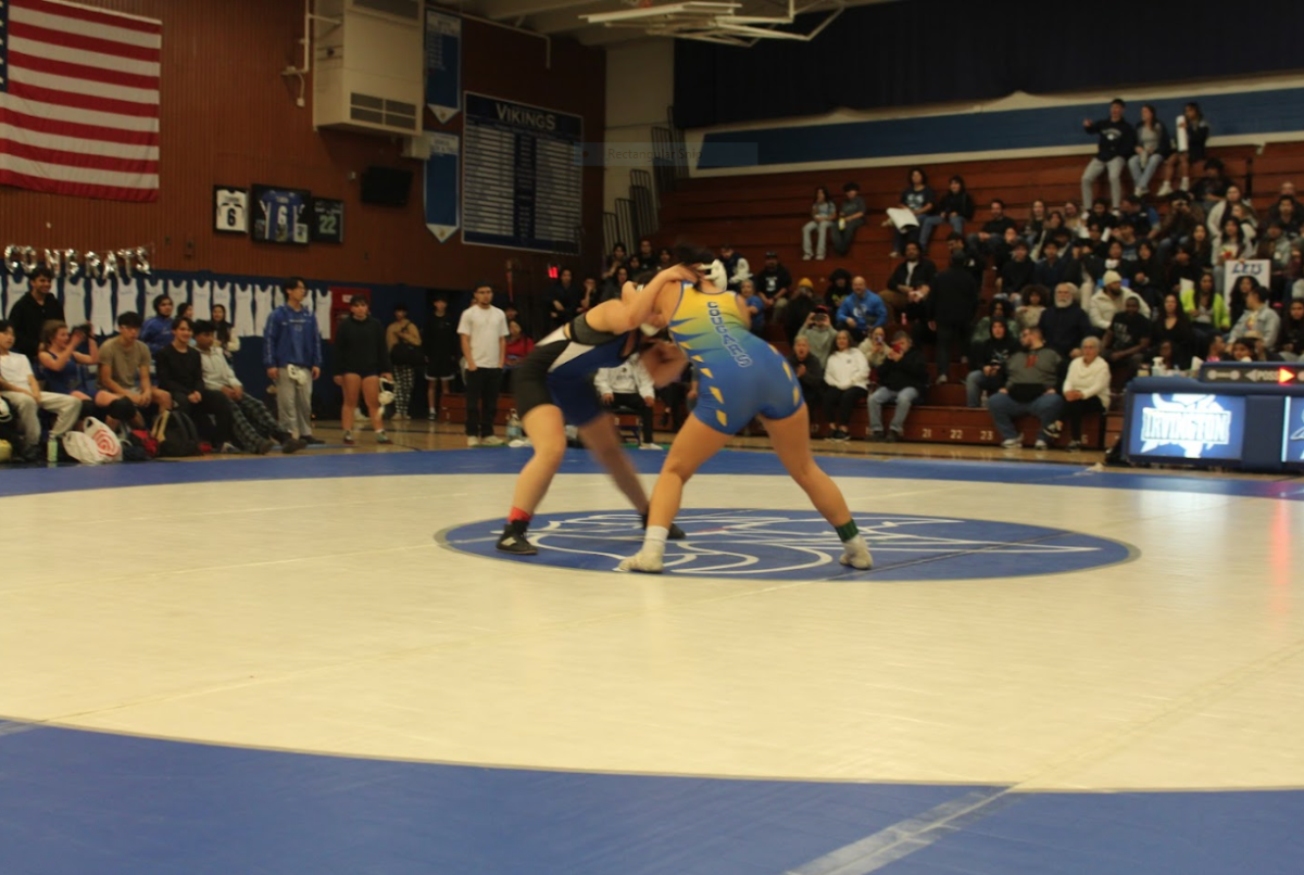  Irvington wrestler in a headlock with Newark

