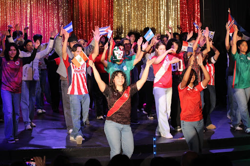 Students at the finale of Ritmo dance with energy to end the night.