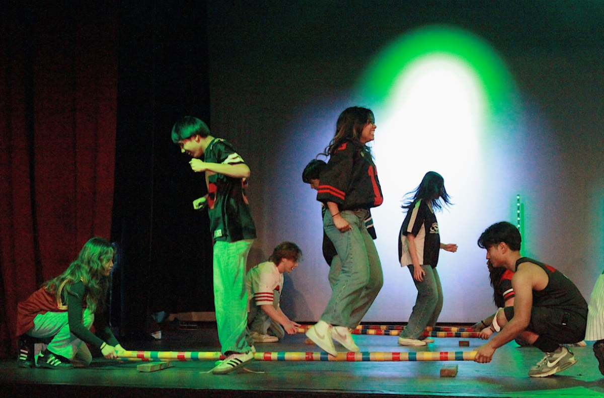 Filipino Youth Association (FYA) members Kylie Chiuco (12) and Jayden Recinto (10) participate in tinkling, a traditional folk dance.