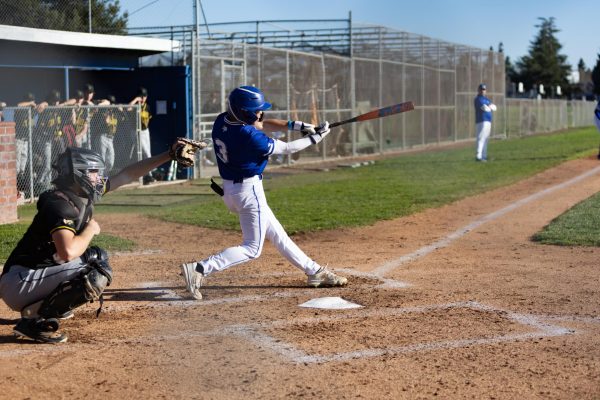 Brayden Kubiak (11) strikes the ball.