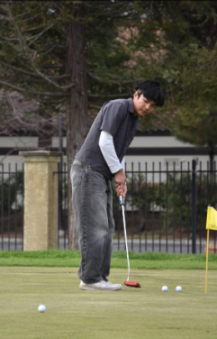 Edward Miu (10)  putting on the putting green 
