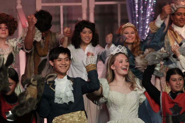 The cast of Cinderella, with Ella (Rachel Ristau) and Prince Topher (Daniel Sadsad) in the center, bow in the show's final moments.